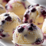 hyper-realistic lemon-blueberry frozen yogurt bites on tray