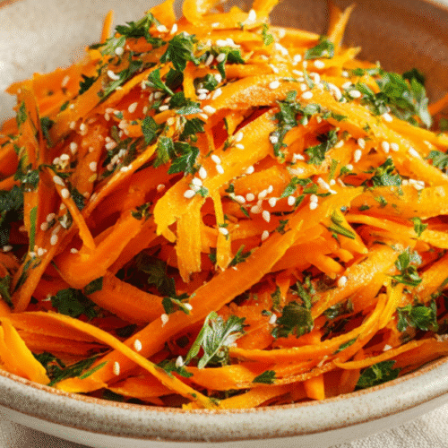 Amazing Retinol Carrot Salad for Glowing Skin and Gut Health 3 Pouring dressing on retinol carrot salad